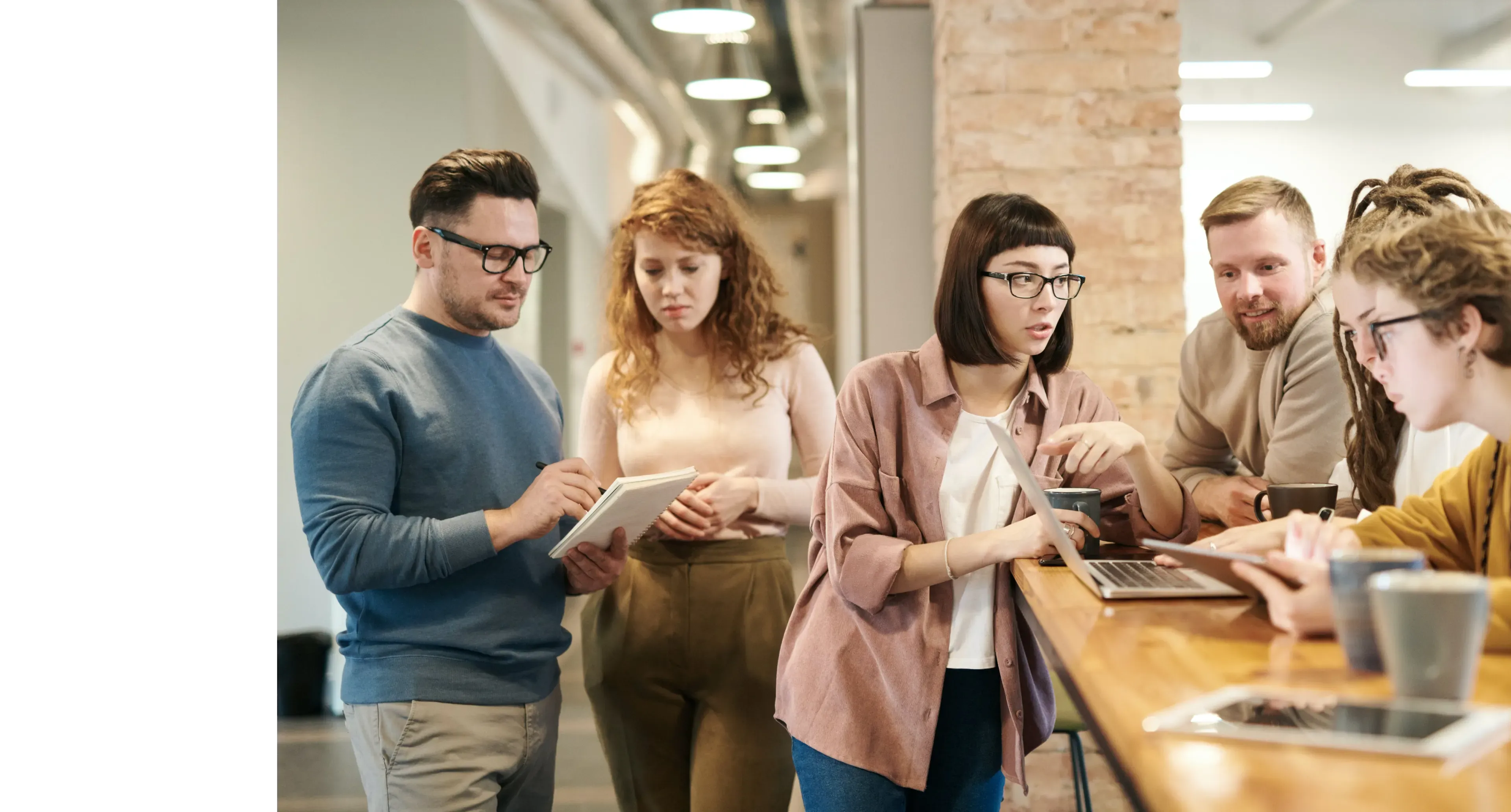 Colleagues working together at a desk in a small-business office