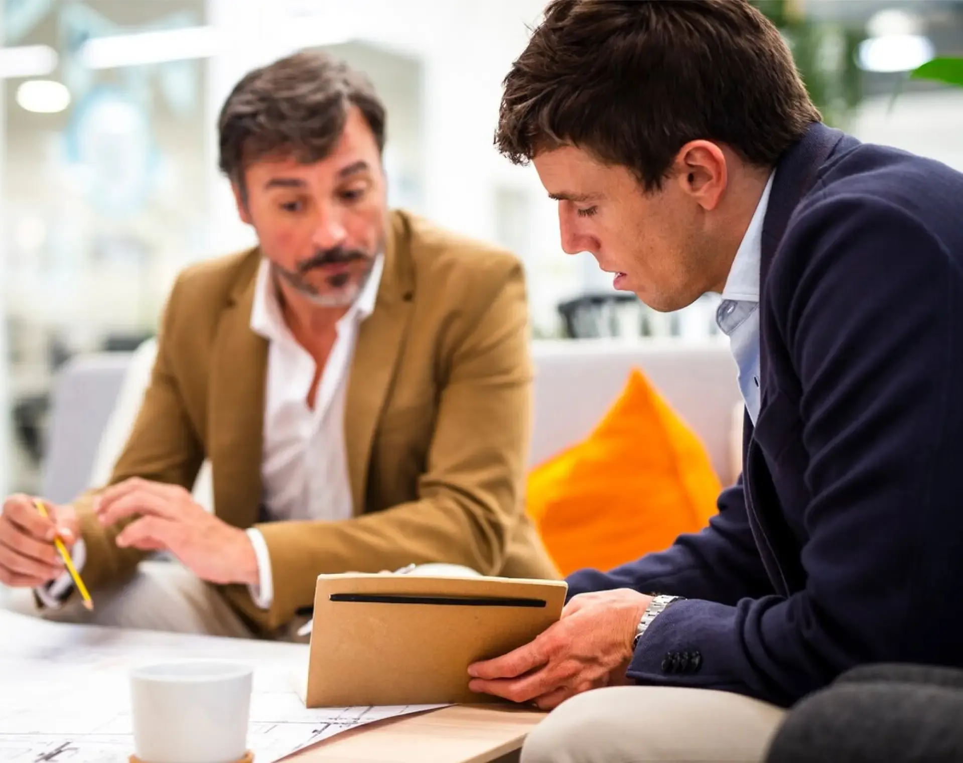 Business owners reviewing their new website and search rankings in a meeting