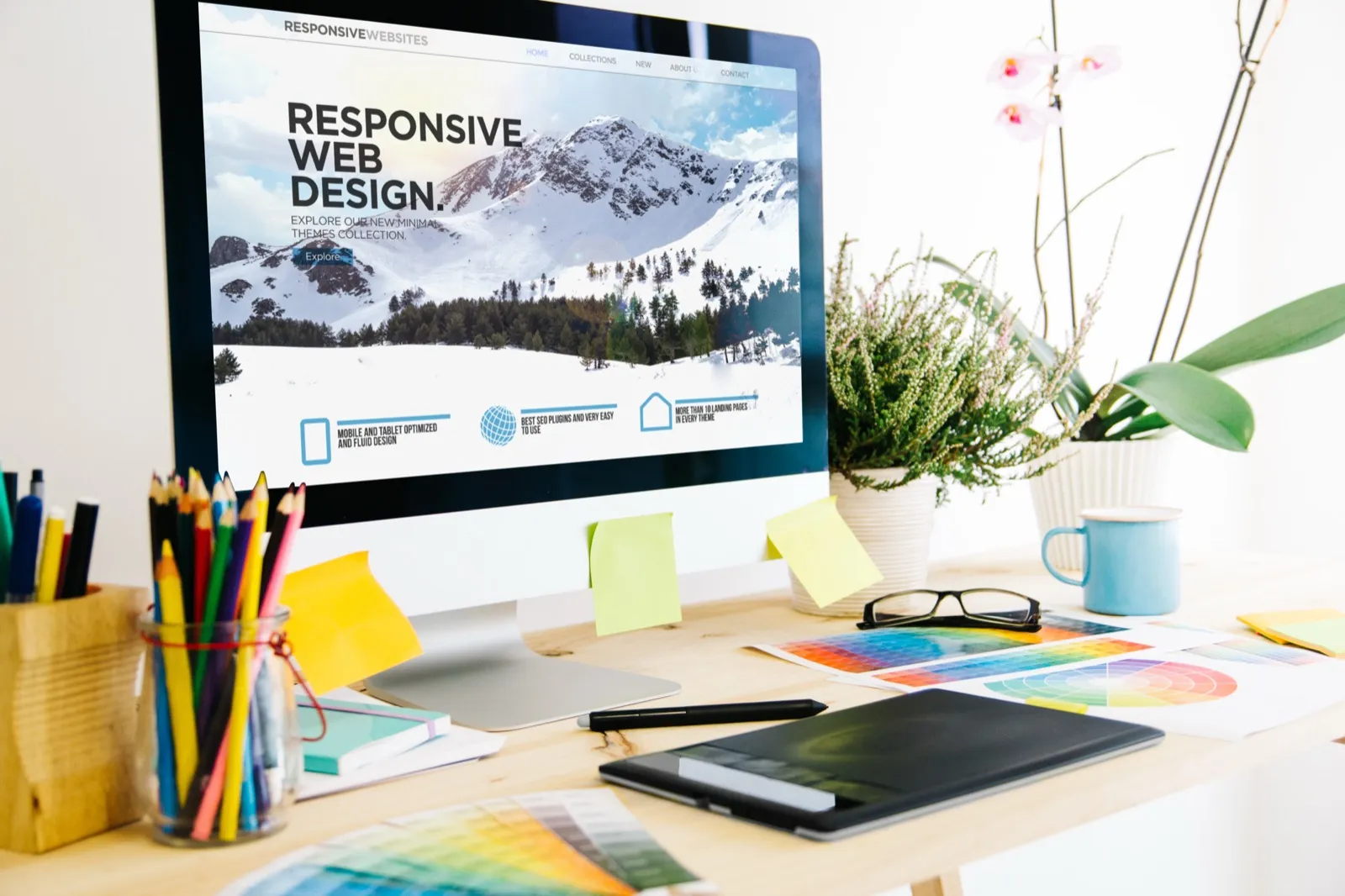 Responsive web design shown on a monitor in a design studio