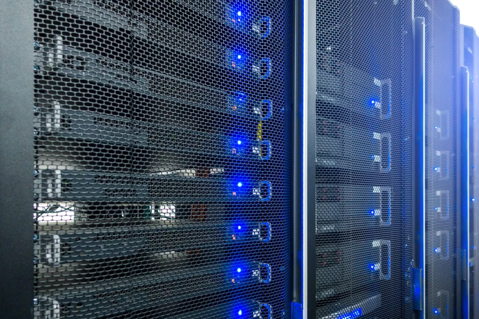 Server racks with blue status lights in a modern data center